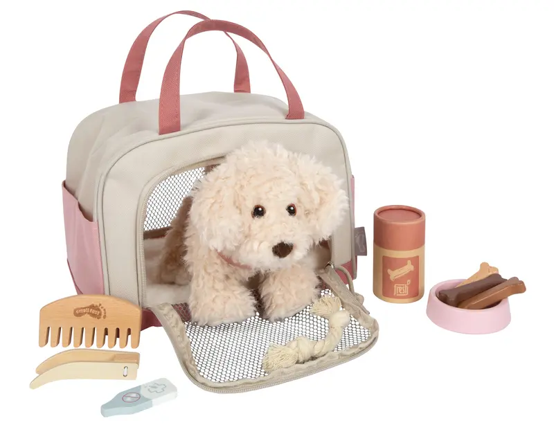 Chien avec sac et kit de soins rose